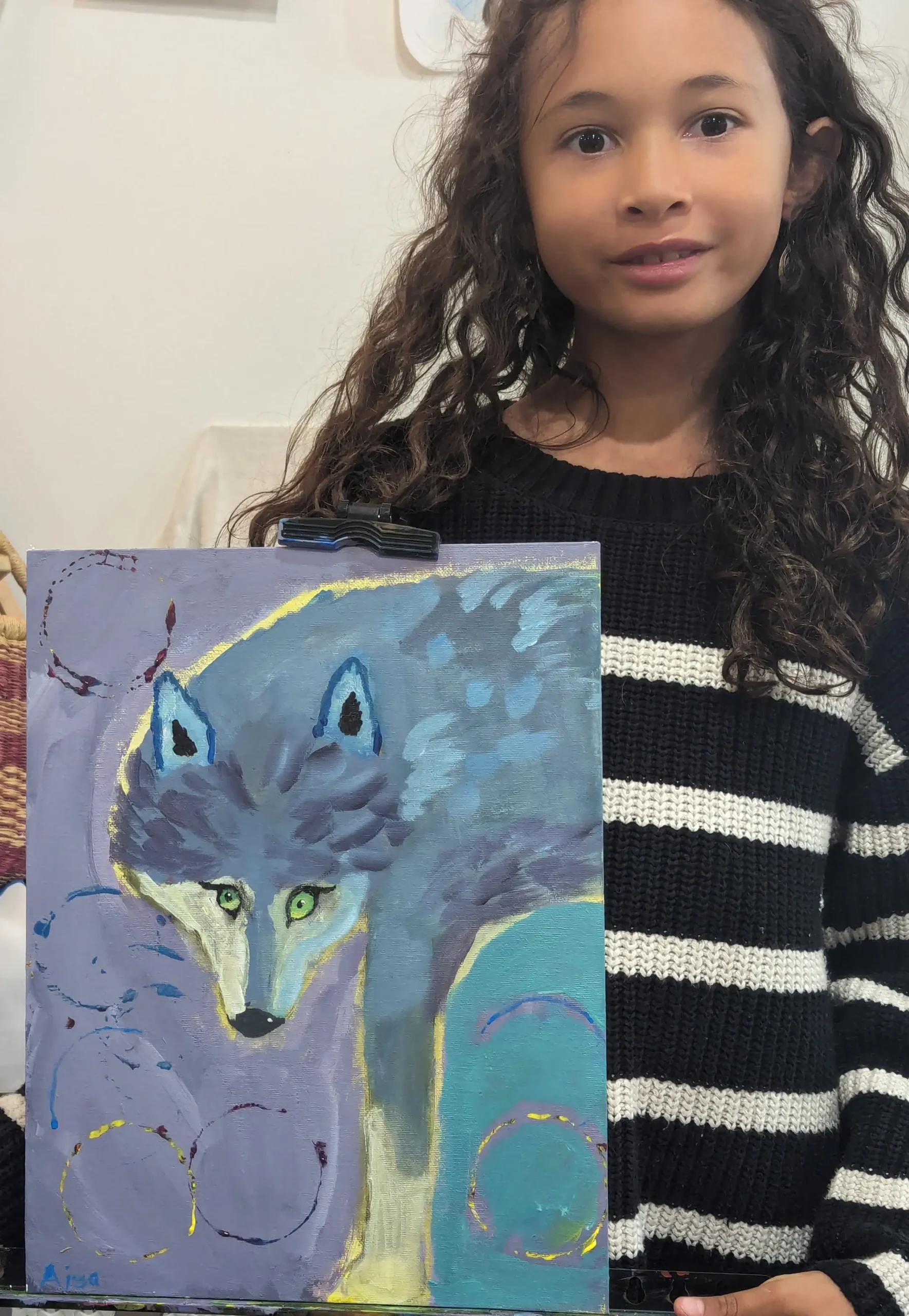 artwork of wolf being held by a young girl art student