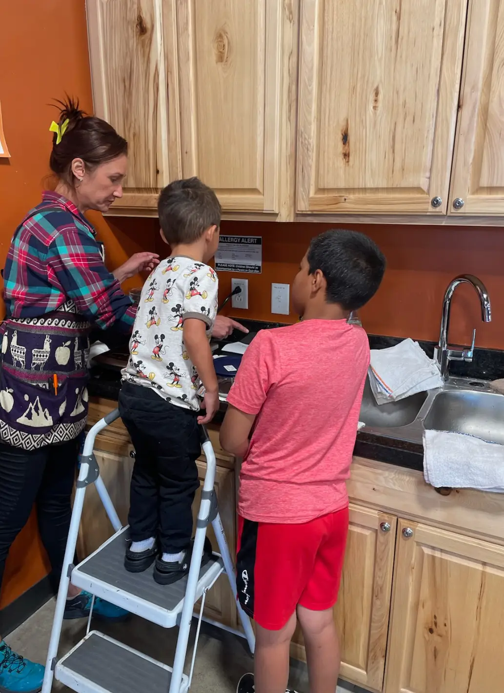 Baking Fun in the kitchen with two boys and woman