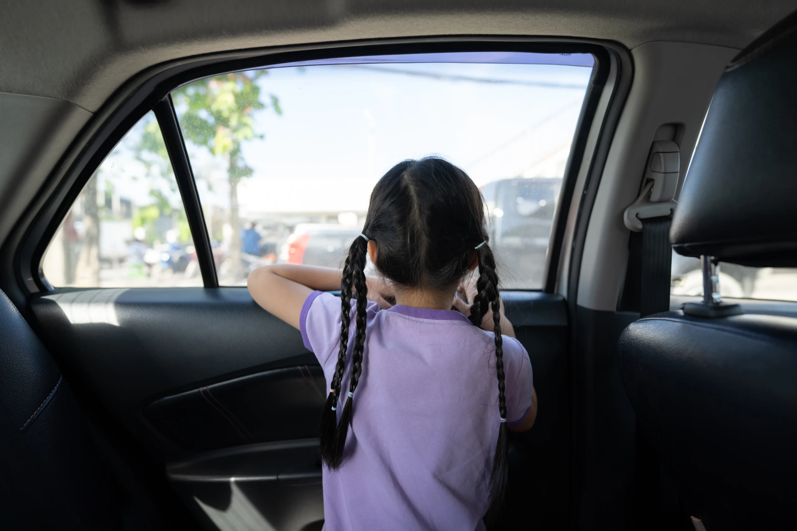 girl looking out car window