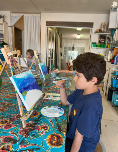 boy painting landscape