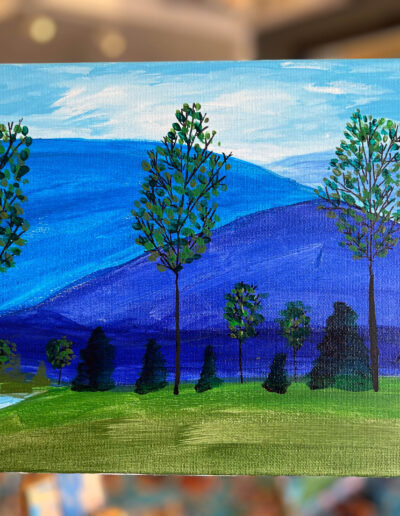 Painting of three trees in front of blue mountains