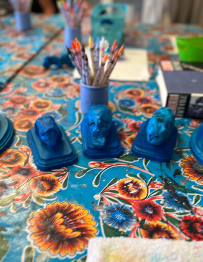 five blue animal sculptures