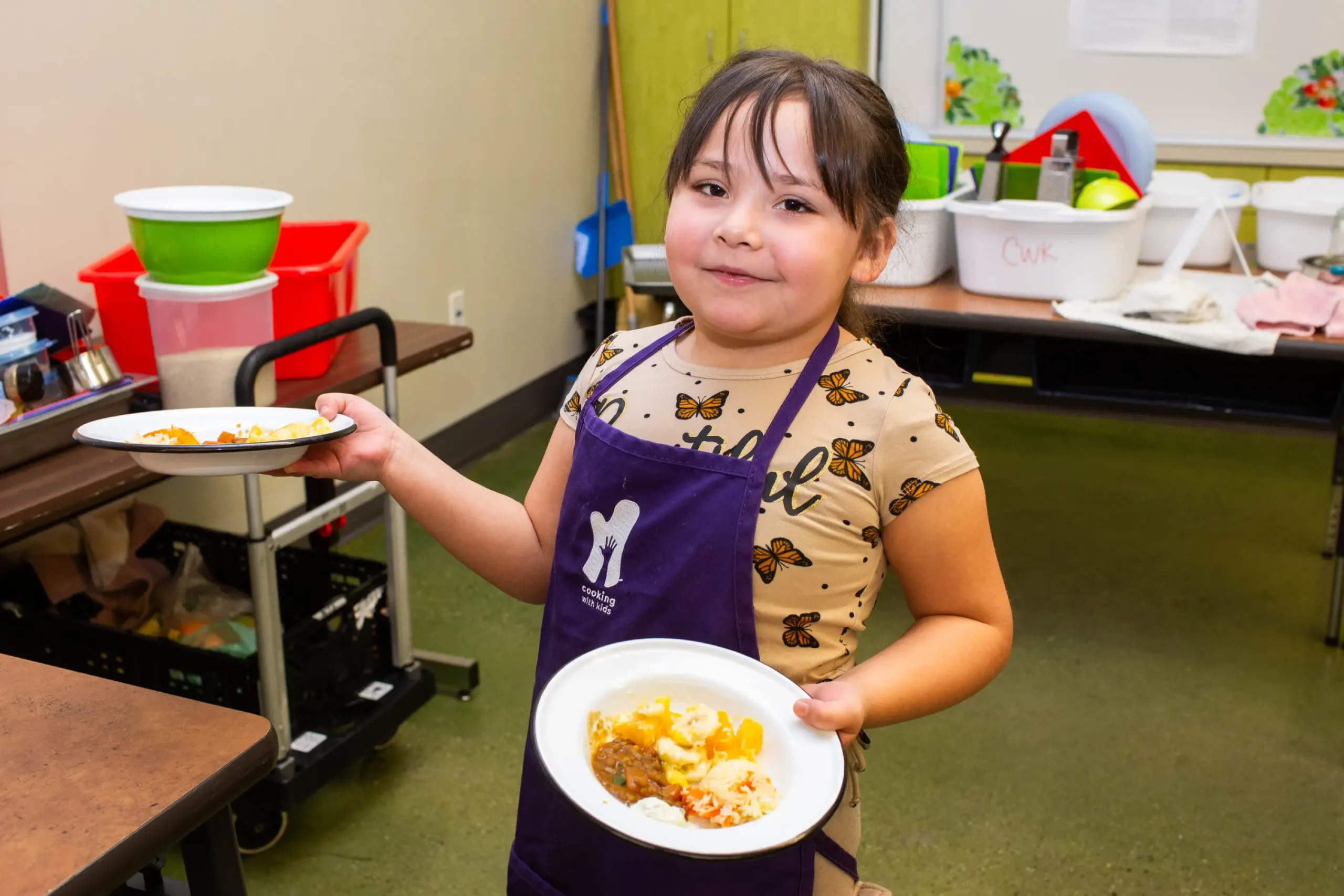 Young Child Serving Food