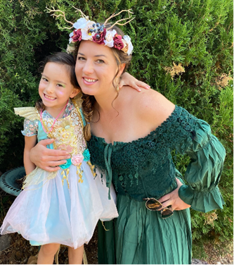 A mom and daughter have fun dressing as a forest fairy and a<br />
mermaid at the SF Renaissance Faire.