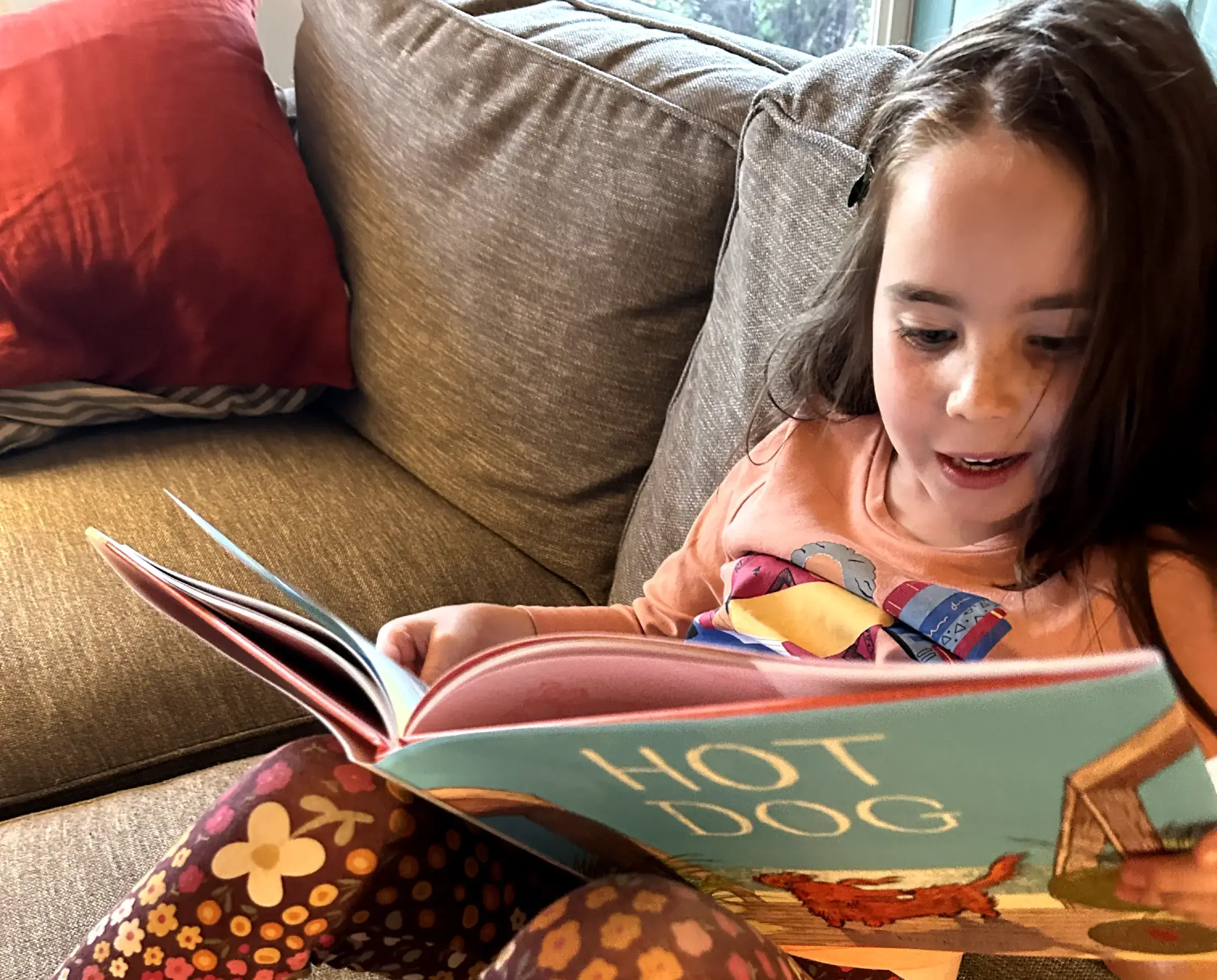 Kindergartener Zadie Barnes tries to sound out some words.