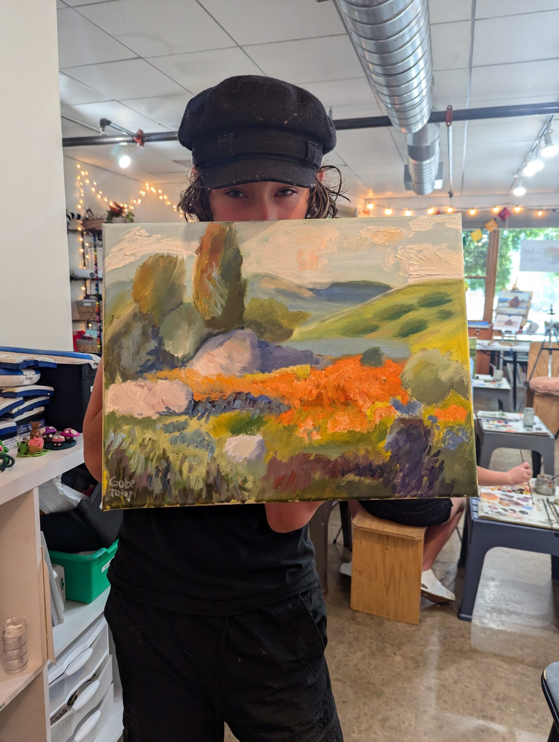 student shows landscape painting