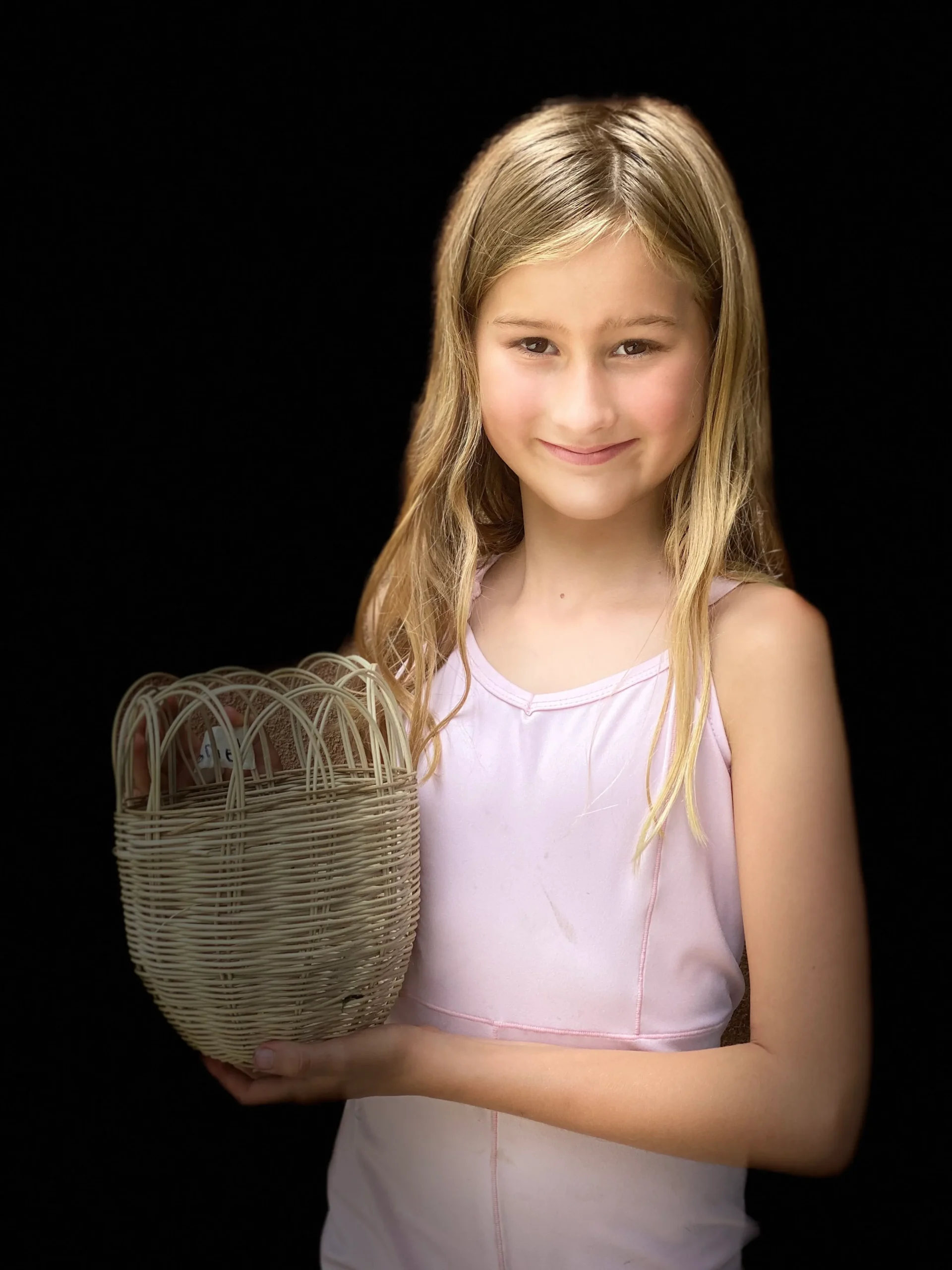 girl displaying her basket