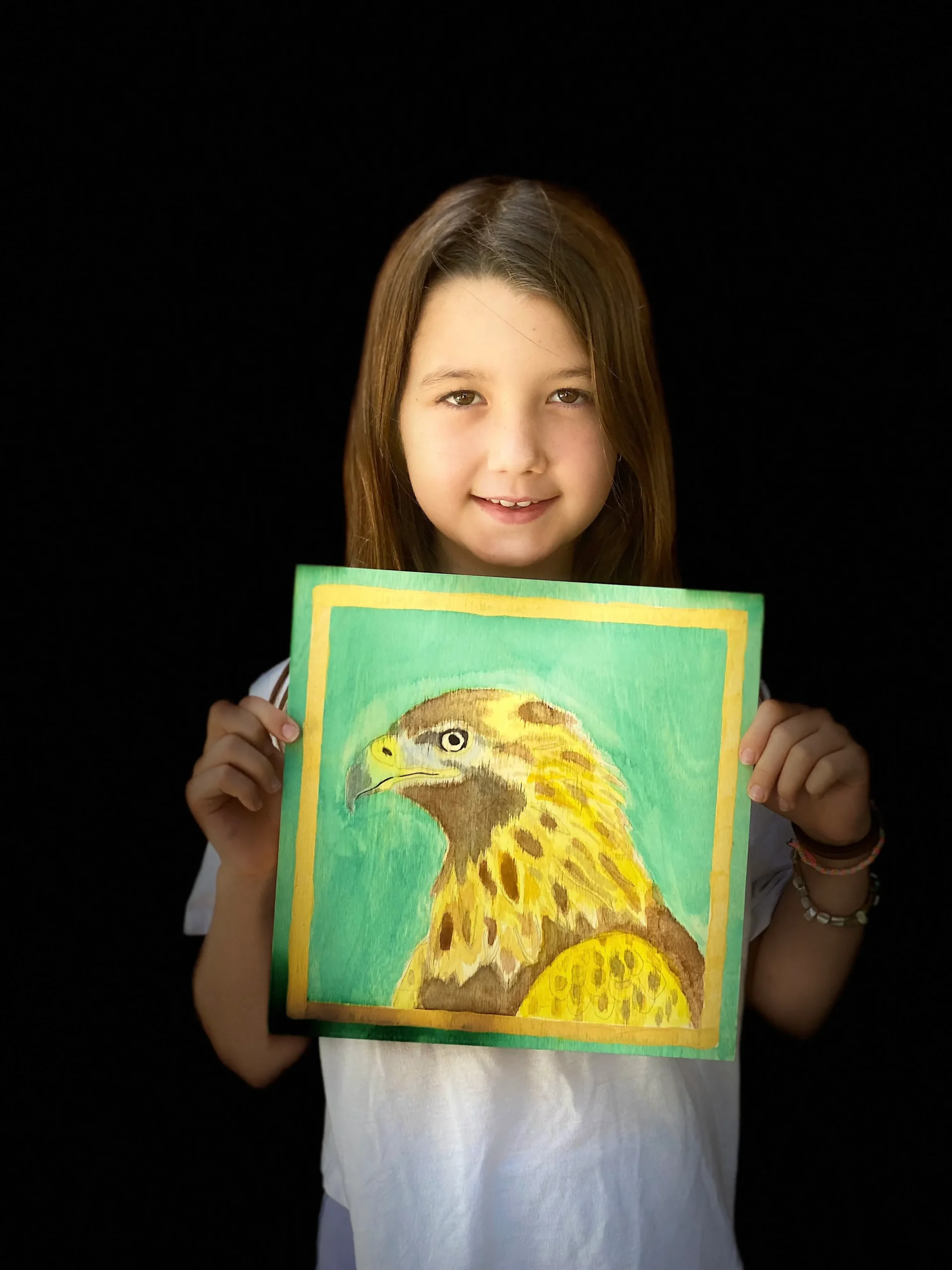 girl showing hawk painting