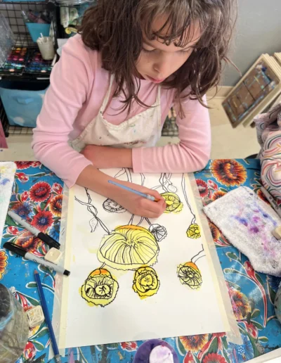 student drawing flowers