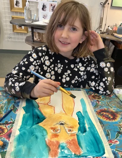 girl painting a fox