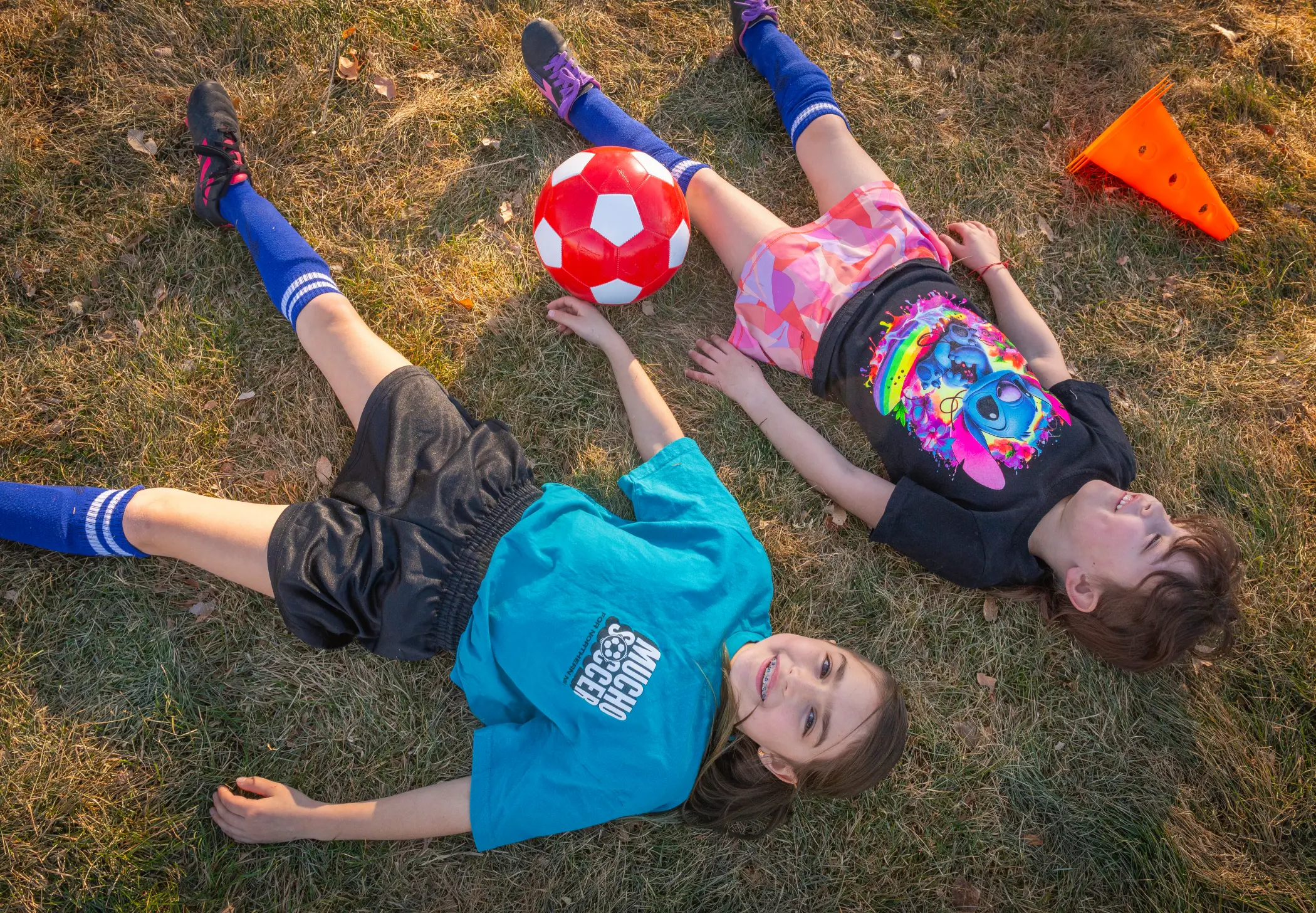 Rylynn and Raegan enjoying the outdoors after playing soccer