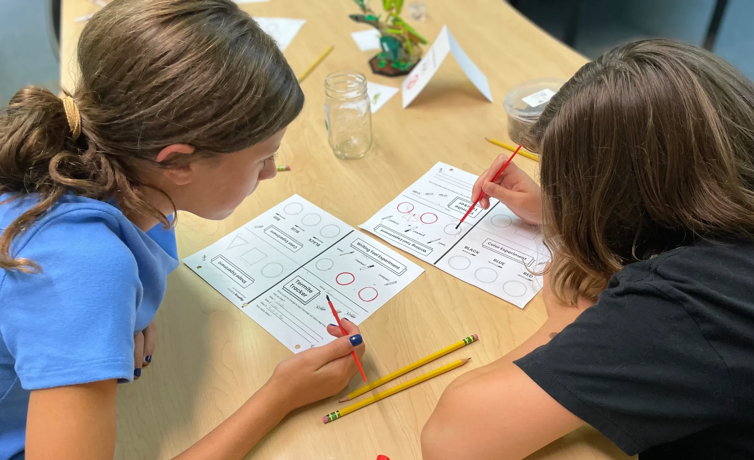 Middle school students work together on assignments.