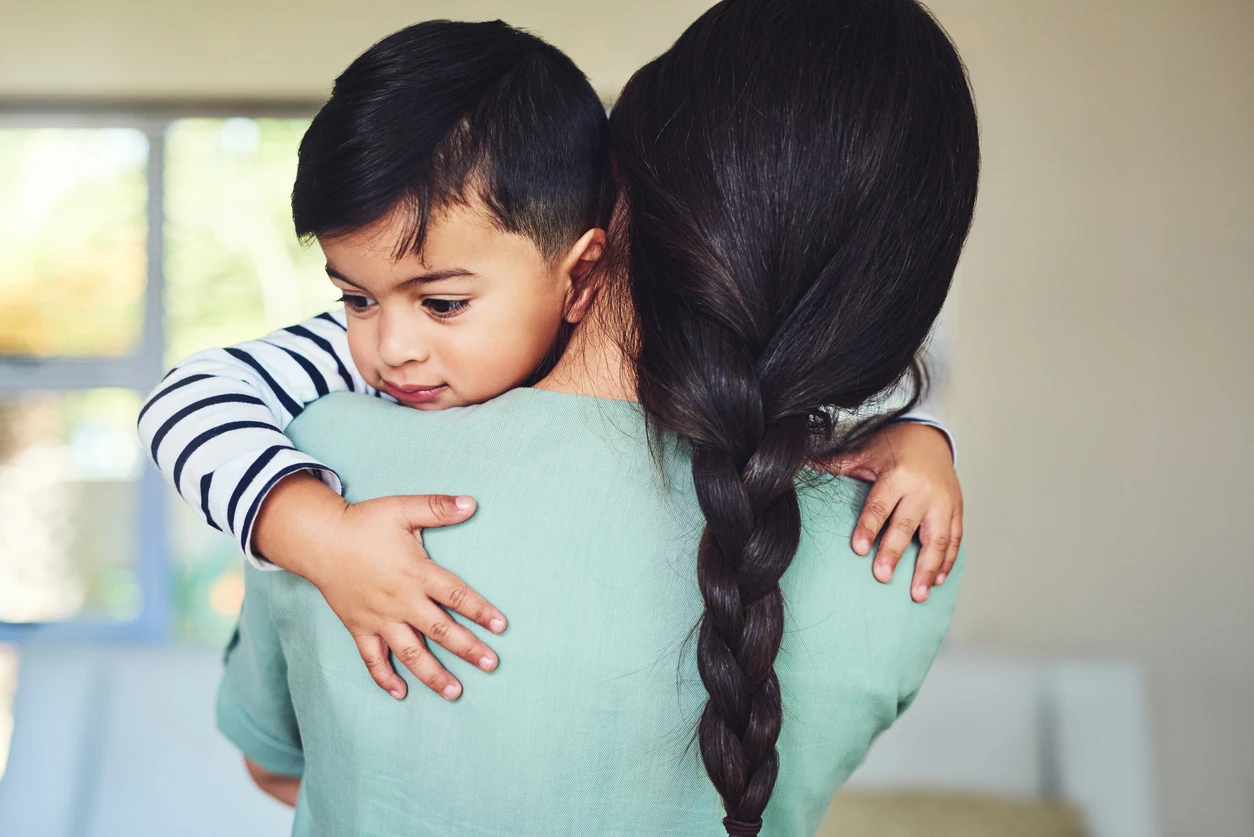 mother holding her son